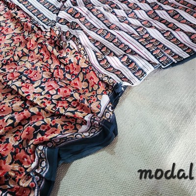 Saffron Sunset Floral Symphony Modal Silk Saree