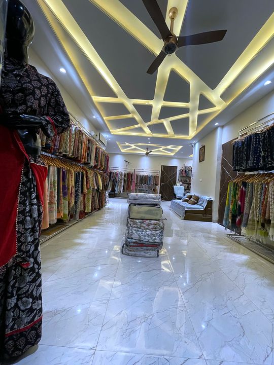 Main hall of Blockart store in Jaipur with block print sarees on both walls
