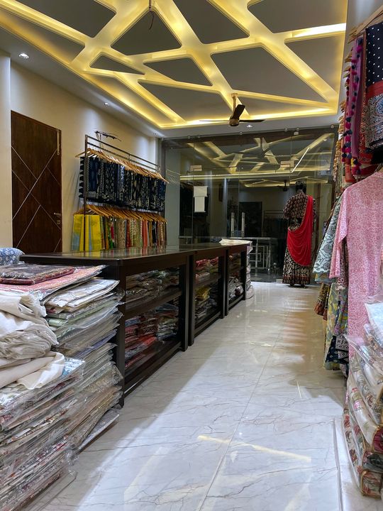 Display counters, bedsheet stacks and the glass entrance