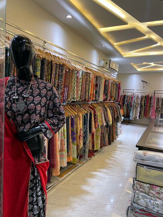 Block print outfit on a mannequin in front of the saree wall