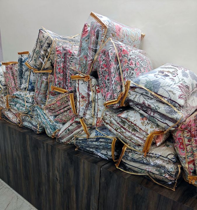 Quilted floral bedcovers and pillow covers in zip bags