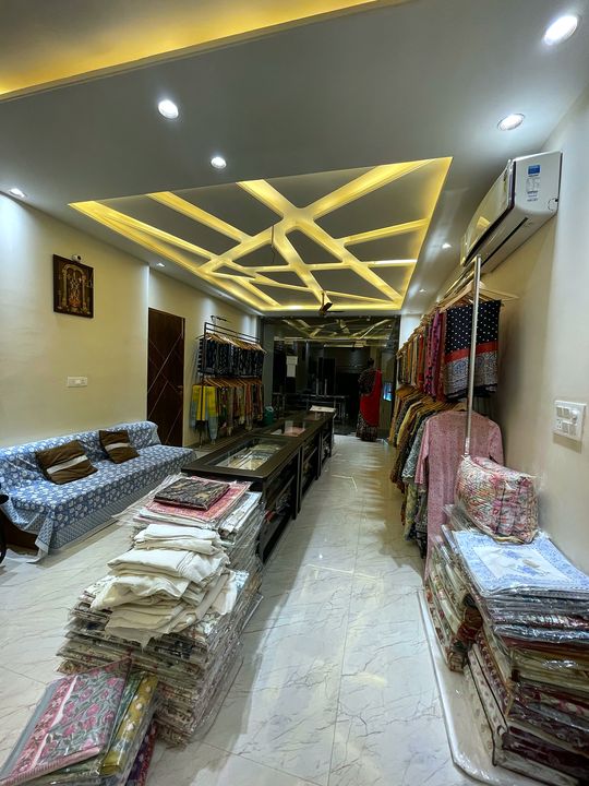 View from the back of the store towards the entrance, with block print sofa cover